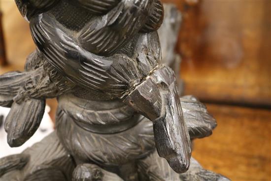 A carved tripod table W.55cm